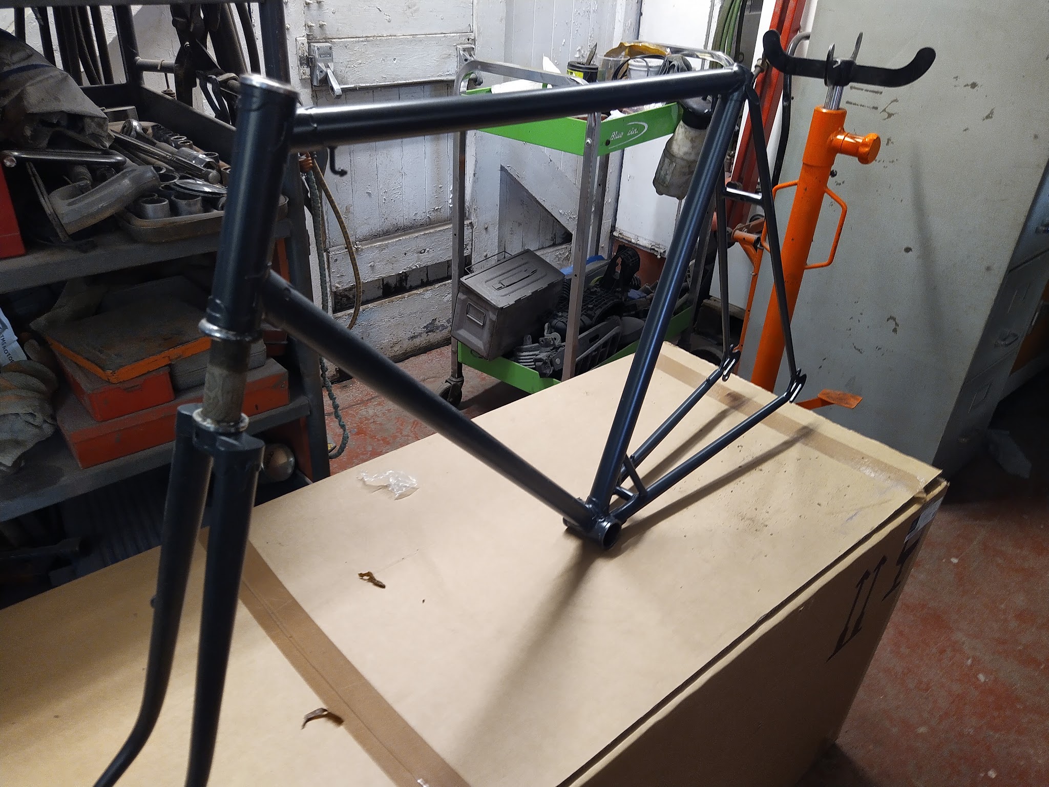 A blasted and refinished bicycle frame in the workshop