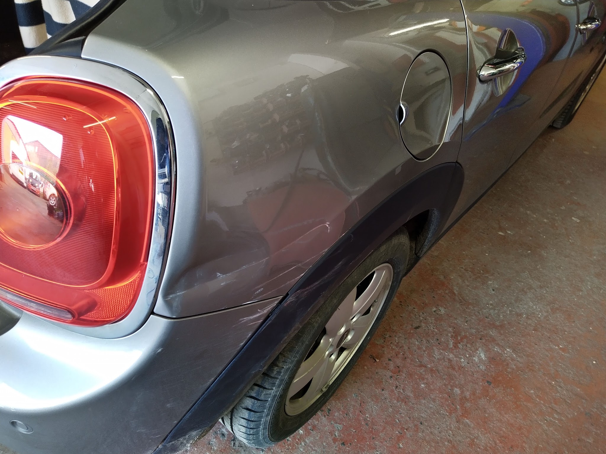 Rear quarter of a silver Mini in the bodyshop