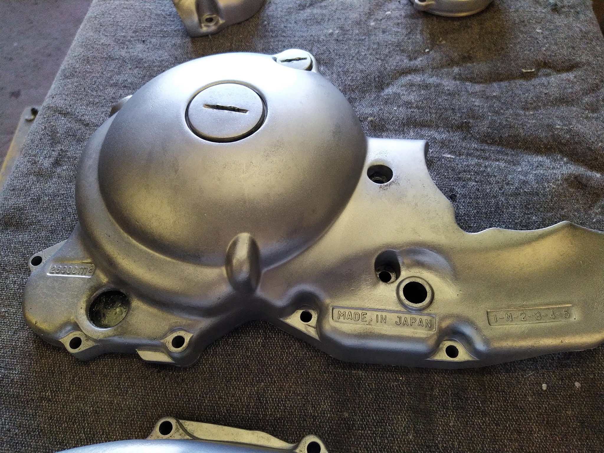 A motorcycle engine casing in the workshop